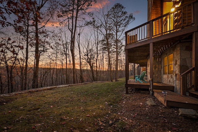 yard at dusk with a balcony