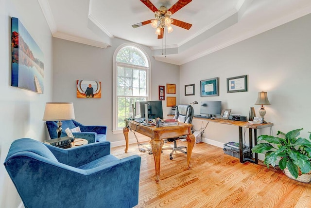 office space with ceiling fan, light hardwood / wood-style floors, and ornamental molding