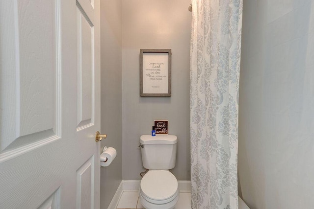 bathroom featuring tile patterned flooring and toilet