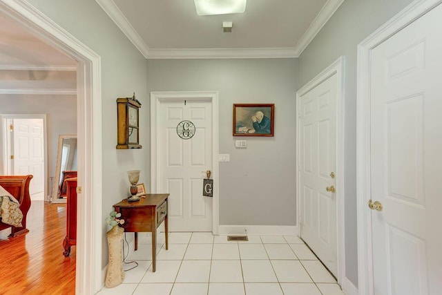 entrance foyer featuring light hardwood / wood-style flooring and crown molding