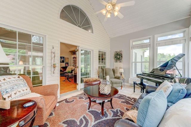 sunroom featuring ceiling fan, lofted ceiling, and wood ceiling