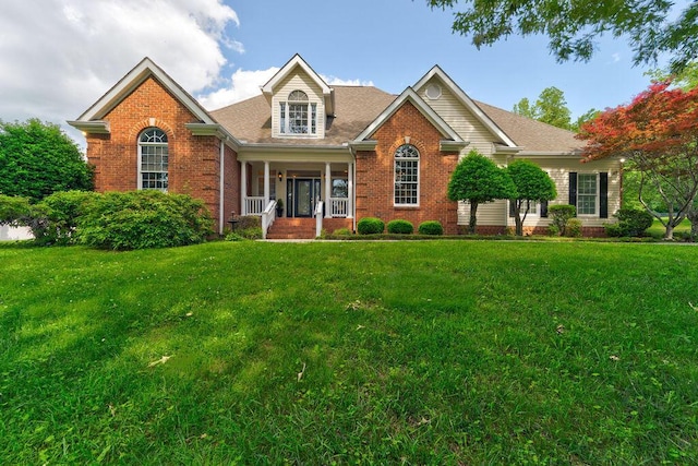 front of property with covered porch and a front lawn