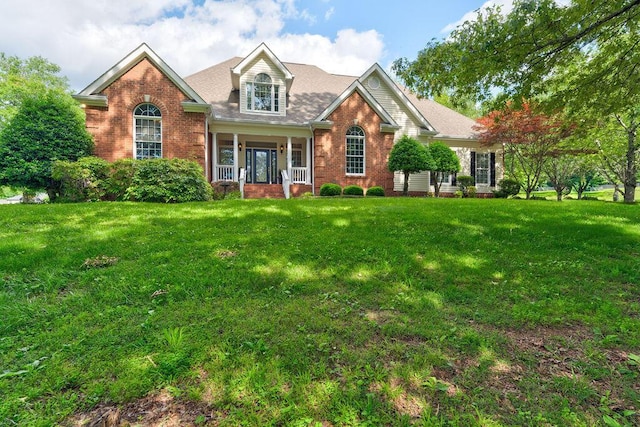 view of front of house featuring a porch and a front yard