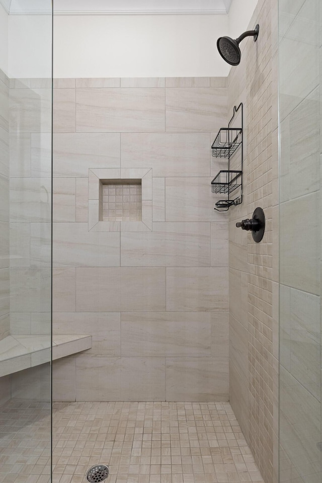 bathroom with tiled shower