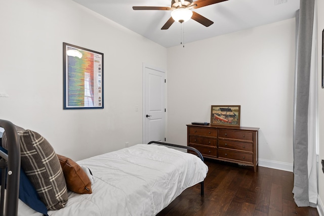 bedroom featuring dark hardwood / wood-style floors and ceiling fan