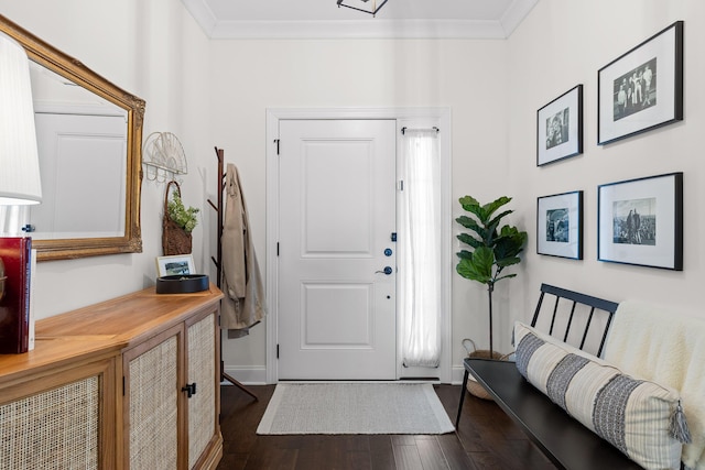 entrance foyer with crown molding and dark wood-type flooring