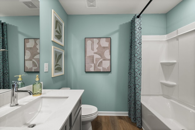 full bathroom featuring vanity, toilet, shower / bath combo with shower curtain, and wood-type flooring