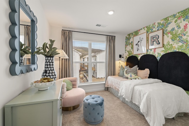 carpeted bedroom featuring multiple windows