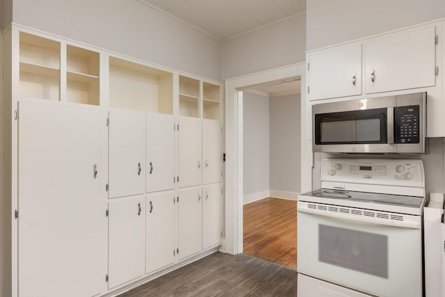 kitchen featuring white cabinetry, dark wood-type flooring, and white electric range oven