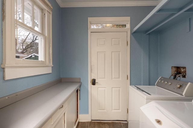 washroom featuring dark hardwood / wood-style floors, cabinets, independent washer and dryer, and ornamental molding