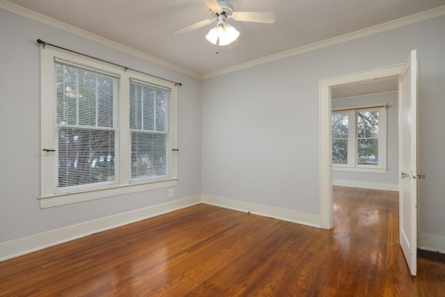 spare room featuring a textured ceiling, dark hardwood / wood-style floors, ceiling fan, and crown molding