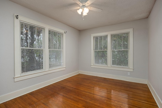 spare room featuring hardwood / wood-style floors, a textured ceiling, and ceiling fan