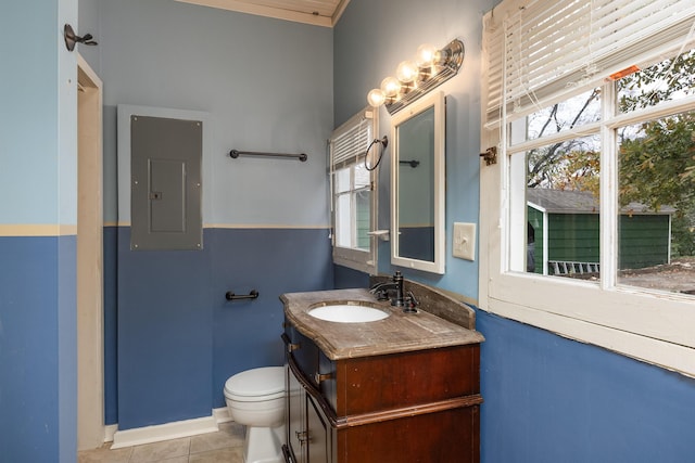 bathroom with tile patterned floors, vanity, toilet, and electric panel