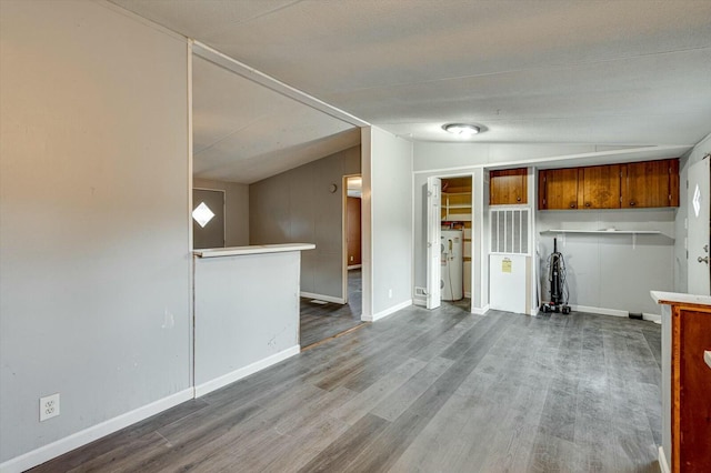 kitchen featuring wood-type flooring and lofted ceiling