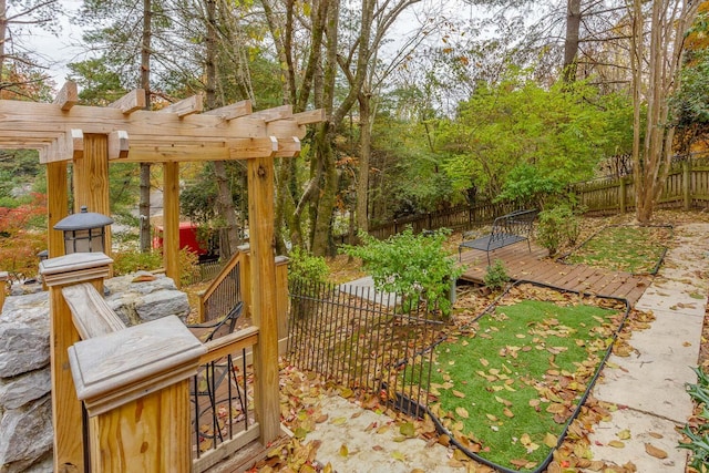 view of yard featuring a pergola and a deck