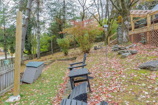 view of yard with a wooden deck