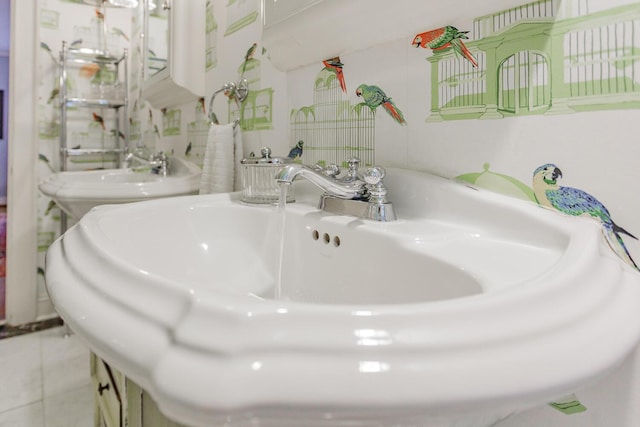 bathroom with sink and tile patterned flooring