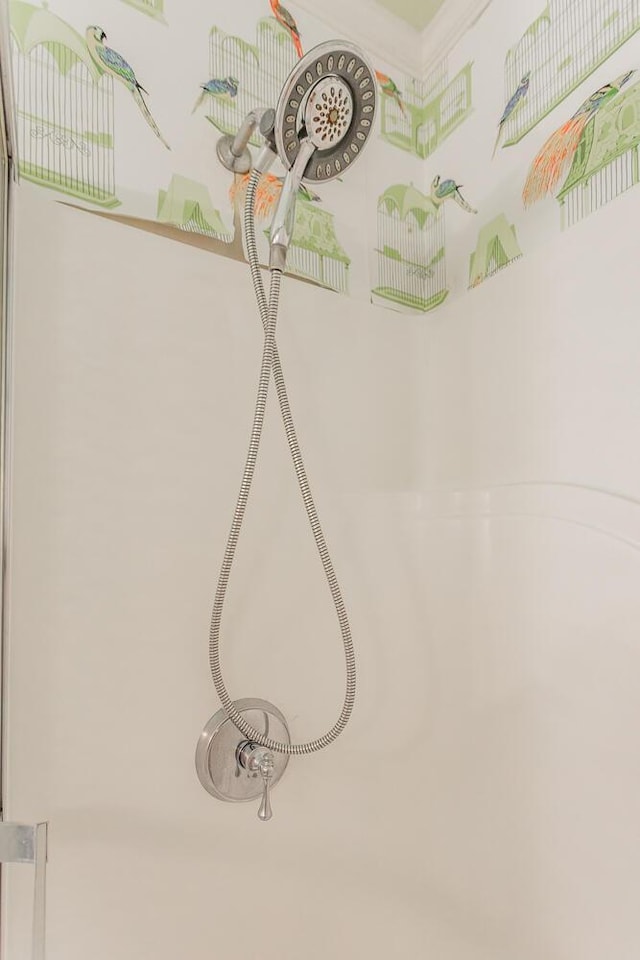 interior details featuring a shower