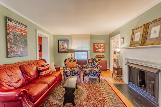 living room with crown molding and hardwood / wood-style flooring