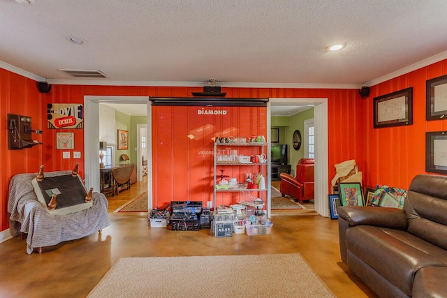 living room with a textured ceiling and crown molding