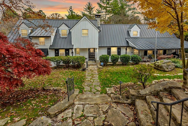 view of back house at dusk