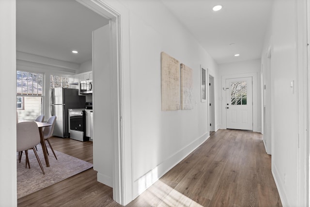 hallway featuring wood-type flooring