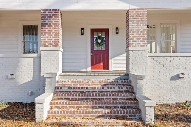 doorway to property featuring covered porch