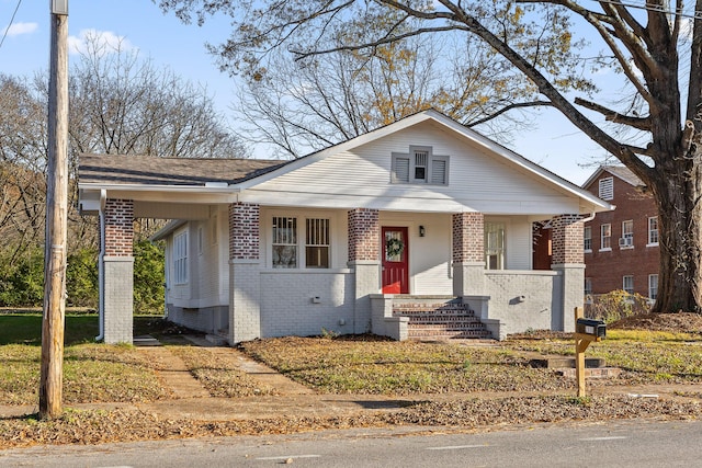 bungalow-style house featuring covered porch