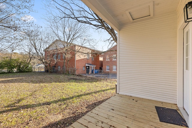 wooden deck featuring a yard