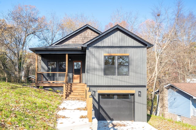 view of front of home with a porch and a garage