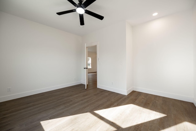 unfurnished room featuring dark hardwood / wood-style floors and ceiling fan