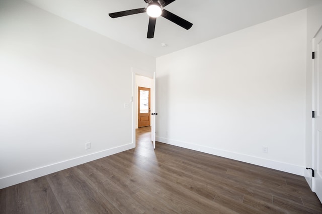 spare room featuring ceiling fan and dark hardwood / wood-style floors