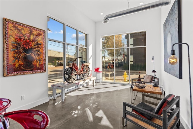 living area featuring concrete floors