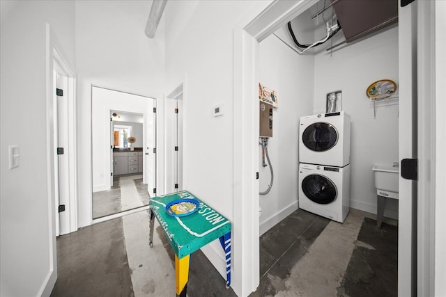 laundry area with stacked washer / dryer