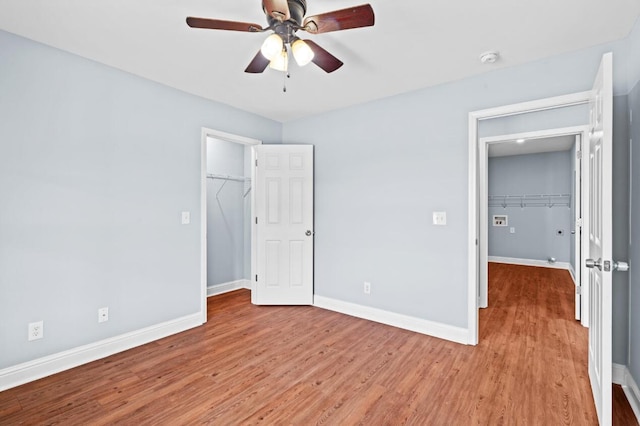 unfurnished bedroom featuring ceiling fan and light wood-type flooring