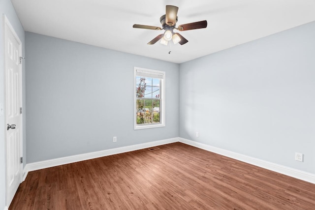 unfurnished room featuring ceiling fan and hardwood / wood-style floors