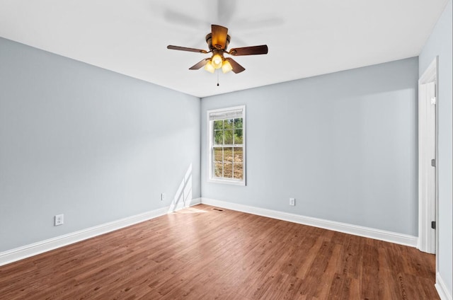 unfurnished room with ceiling fan and hardwood / wood-style flooring