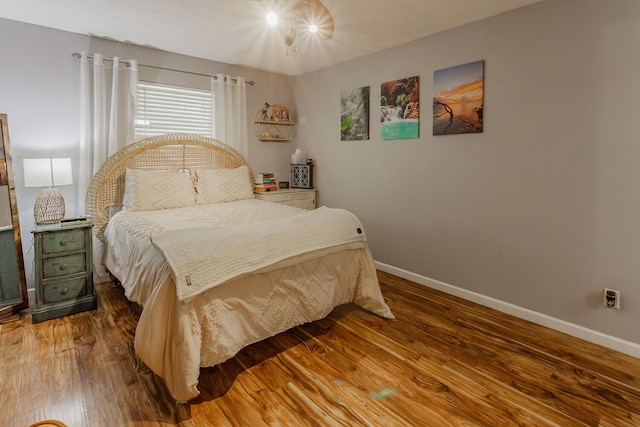 bedroom with hardwood / wood-style floors