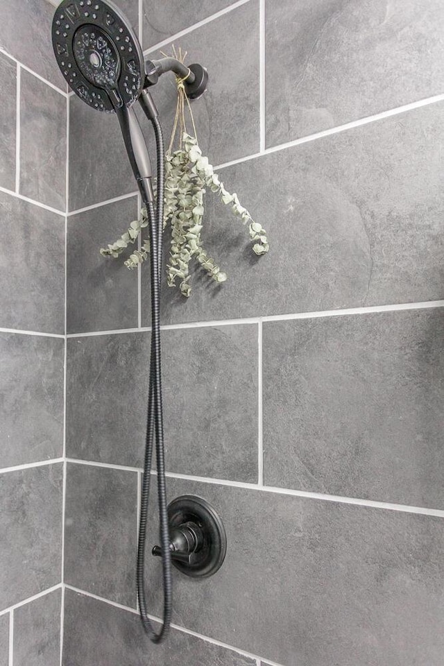 room details with a tile shower