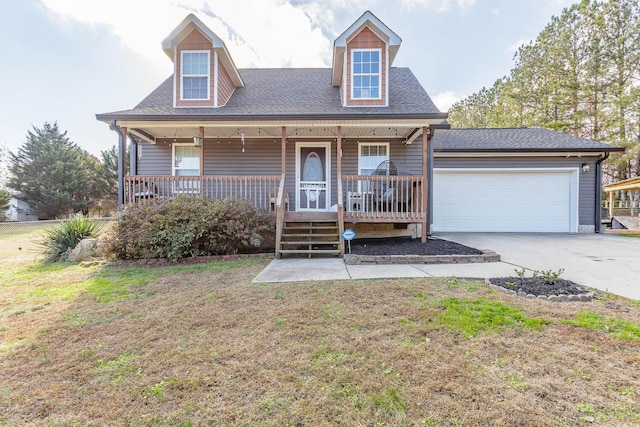 new england style home with a garage, covered porch, and a front lawn