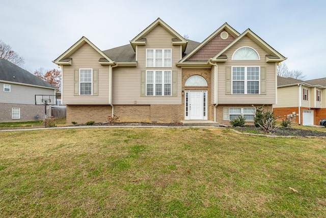 bi-level home with a front lawn