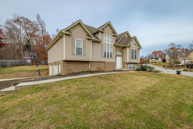 view of front facade with a garage and a front lawn