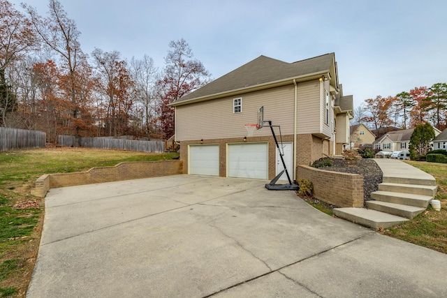 view of side of property with a garage