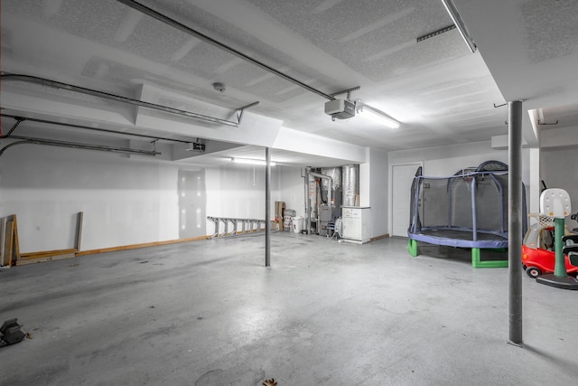 garage with a trampoline and a garage door opener