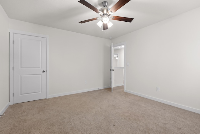 empty room with light carpet and ceiling fan