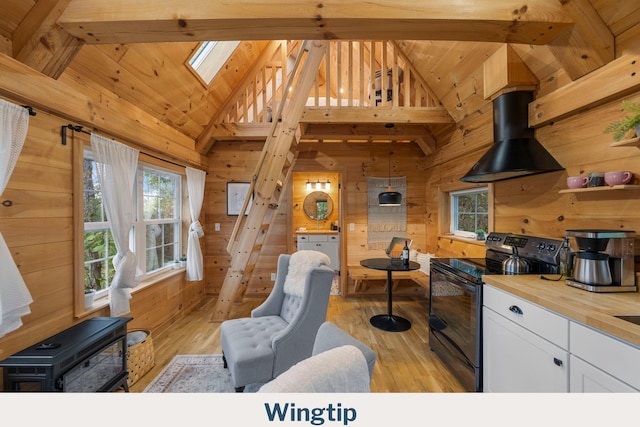 9193 Scenic Hwy, Lookout Mountain, GA 30750 - living area with healthy amount of natural light, wooden walls, light wood-style flooring, a skylight, and beamed ceiling
