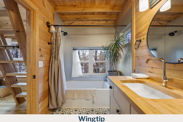 9193 Scenic Hwy, Lookout Mountain, GA 30750 - full bathroom featuring wooden ceiling with exposed beams, vanity, a bath, a shower with shower curtain, and wood finished floors