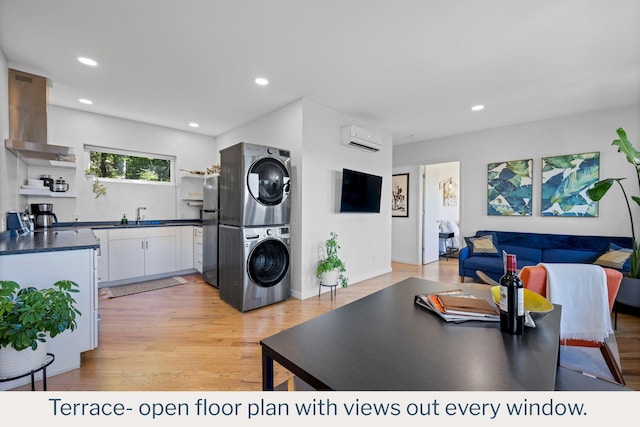 9193 Scenic Hwy, Lookout Mountain, GA 30750 - kitchen featuring stacked washing machine and dryer, open shelves, a wall unit AC, dark countertops, and a sink