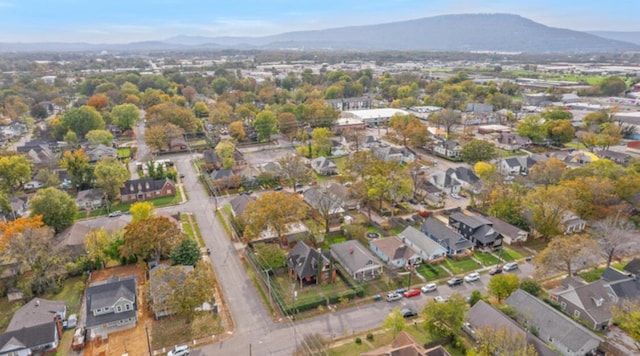 birds eye view of property featuring a mountain view