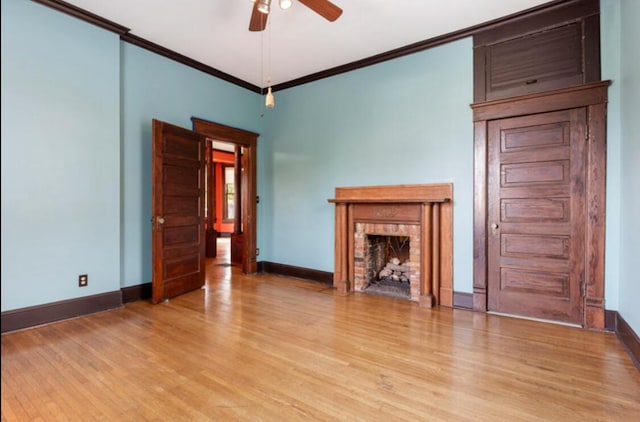 unfurnished living room featuring crown molding, ceiling fan, and light hardwood / wood-style floors